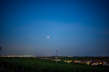 lunar eclipse over the city