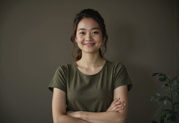 Smiling woman with crossed arms in an adaptive workspace setting