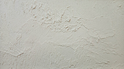 Rough beige cement wall texture background with natural light