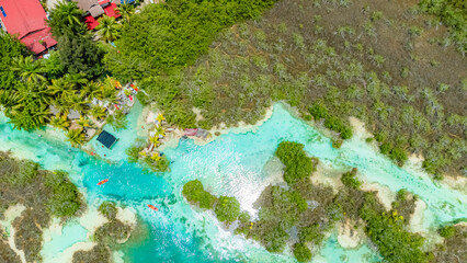 Bacalar, Mexico, Quintana Roo, Beautiful blue river with a green forest in the background