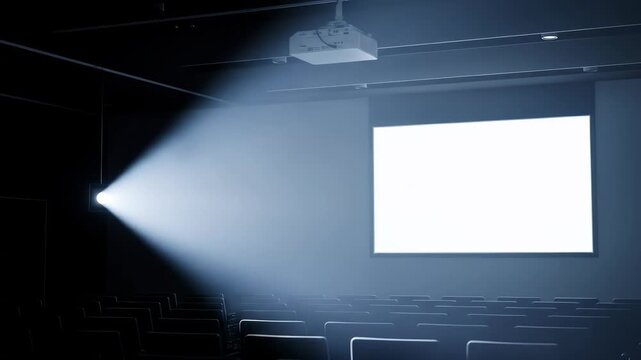 Empty presentation room with projector and blank white screen, concept for business. Rows of seats ready. Copy space for message, presentation or slideshow.