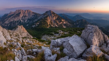 Fototapeta premium alpine. Panoramic alpine landscape at dusk with warm golden light on mountain peaks. travel magazines, destination branding, designed for outdoor magazines and nature guides.