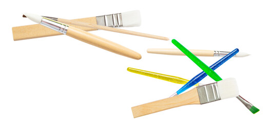 variety of paintbrushes with different colored handles for artistic endeavors