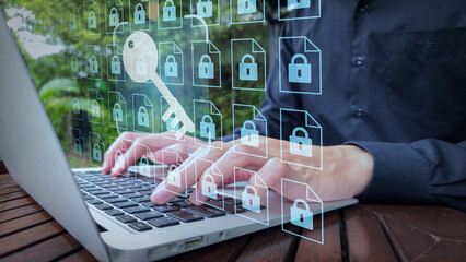 Cybersecurity File Access with Laptop and Encryption Icons in Outdoor Workspace