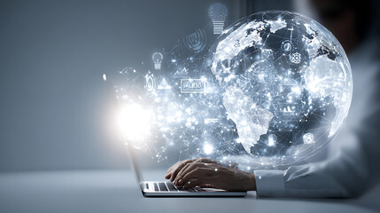 Close up of hands typing on laptop with glowing digital globe and network connections technology data