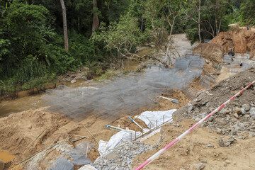 Gravel flows powerfully, land is disturbed and barren