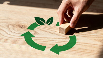 HandPlacingBlockOnRecyclingSymbol