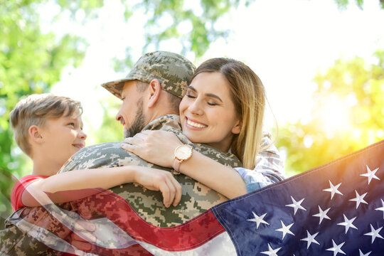 Military man and his family outdoors, double exposure with national flag of USA