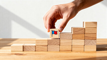 Hand Placing Flag Block on Steps