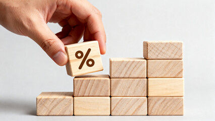 Hand placing percent block on steps