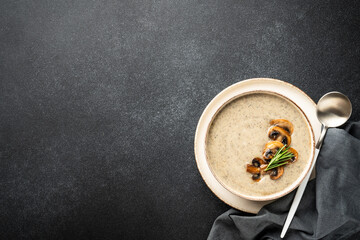 Mushroom soup puree on white kitchen table.