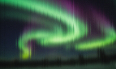 Beautiful green and purple aurora borealis dancing in the night sky