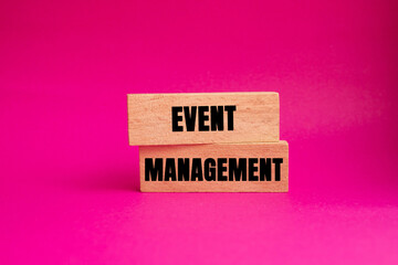Event Management message written on wooden blocks on pink background. Conceptual Event Management symbol. Copy space.