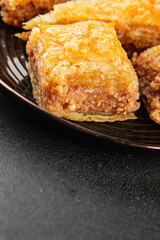 Baklava with pistachios and almonds dessert oriental sweets natural product tasty snack fresh delicious gourmet food background on the table rustic top view copy space