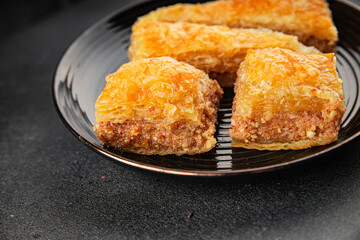 Baklava with pistachios and almonds dessert oriental sweets natural product tasty snack fresh delicious gourmet food background on the table rustic top view copy space