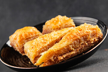 Baklava with pistachios and almonds dessert oriental sweets natural product tasty snack fresh delicious gourmet food background on the table rustic top view copy space