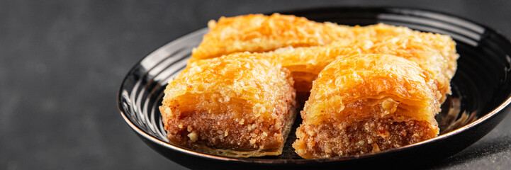 Baklava with pistachios and almonds dessert oriental sweets natural product tasty snack fresh delicious gourmet food background on the table rustic top view copy space