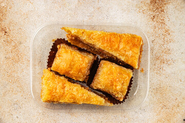 Baklava with pistachios and almonds dessert oriental sweets natural product tasty snack fresh delicious gourmet food background on the table rustic top view copy space