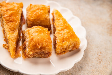 Baklava with pistachios and almonds dessert oriental sweets natural product tasty snack fresh delicious gourmet food background on the table rustic top view copy space
