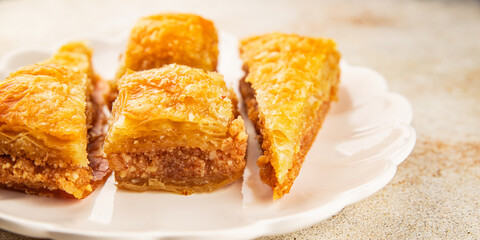 Baklava with pistachios and almonds dessert oriental sweets natural product tasty snack fresh delicious gourmet food background on the table rustic top view copy space