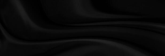 Black gray satin dark fabric texture luxurious shiny that is abstract silk cloth panorama background with patterns soft waves blur beautiful.