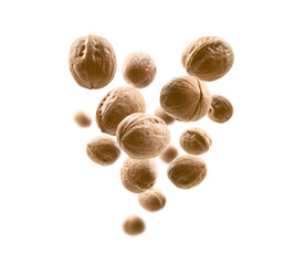 Whole walnuts levitate on a white background