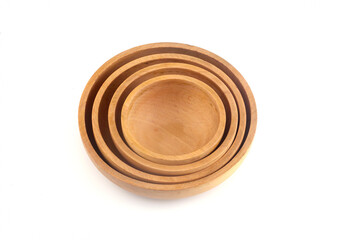 Various sizes of wooden bowls on white background 