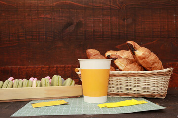 A delicious French breakfast with fresh croissants, colorful macarons