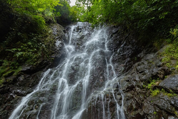 Beautiful mountain waterfall view from the bottom in Georgia