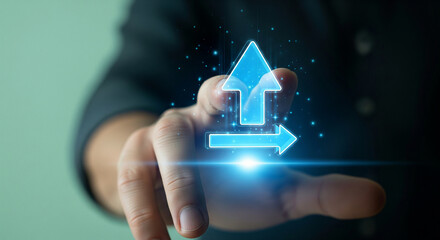 Hand interacting with a futuristic digital interface showing glowing blue arrows for upload and data transfer, symbolizing progress, innovation, and growth strategy