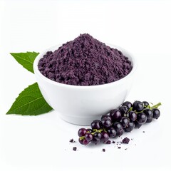 A?a? powder filled into a white bowl placed on a white backdrop with grapes