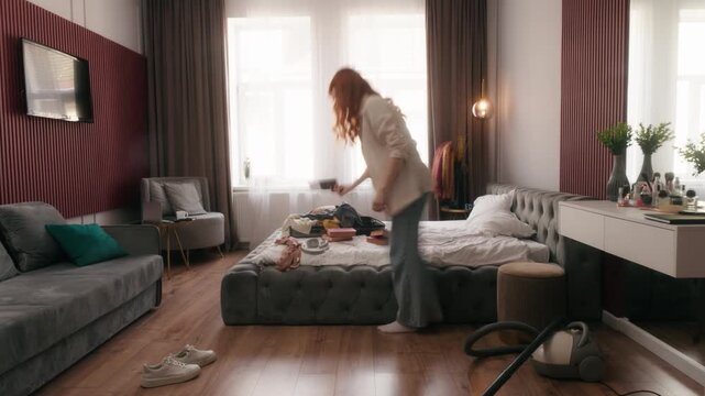 Time-lapse view woman cleaning home bedroom disorder trash cloth in mess house Caucasian girl female householder housewife housekeeping doing housework domestic clean in loan rent tenant timelapse