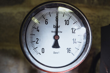Industrial pressure gauge showing 8 bar mounted on pipe for safety inspection and mechanical...