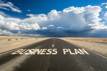 Straight asphalt road with business plan text leading towards a cloudy horizon sky
