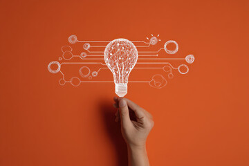 Idea spark, hand holding lightbulb showing creativity
