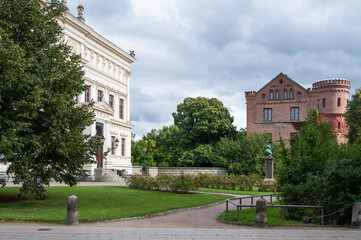 Obraz premium Two historic buildings in Lund city center in Sweden during autumn
