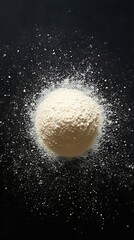 Mound of White Powder with Scattered Particles on a Dark Surface Backdrop