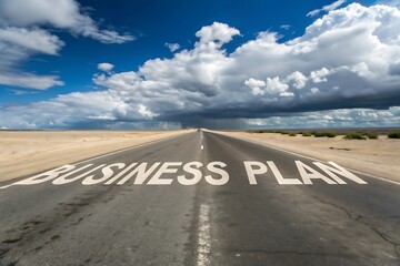 Straight road with business plan written leading to the horizon under cloudy sky