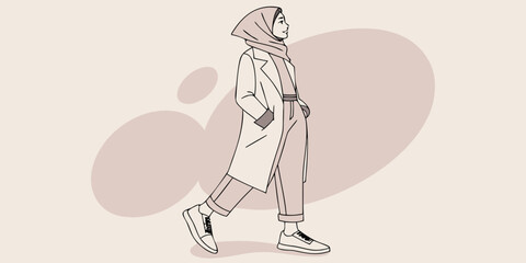 Stylish woman in hijab walking on the street