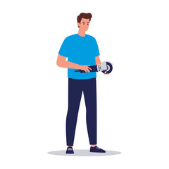 Man holding a grinder, wearing a blue shirt and dark pants, standing against a white background.