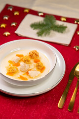 Homemade broth soup on festive Christmas table