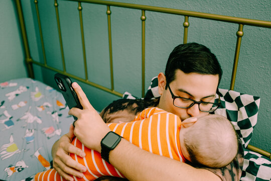 father kissing baby