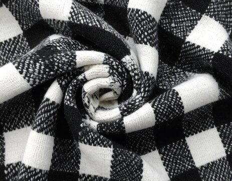 Black and white checkered fabric swirled