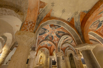 Ancient crypt frescoes illustrating religious scenes in Ascoli Piceno