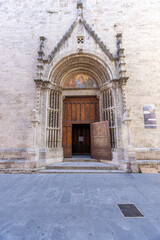 Ornate church portal with fresco in Ascoli Piceno, Italy