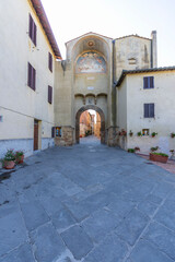 Archway and fresco painting in Pienza, Tuscany, Italy