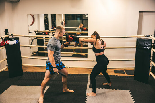 Boxing training session in a gym with focus on technique and strength building for athletes