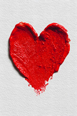 Intense Red Paint Heart Shape Brush Stroke with Visible Texture on Rough White Paper Background