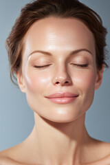 Obraz premium Ultra detailed close up of woman with fair radiant skin and relaxed expression, eyes closed, showcasing smooth and healthy complexion with natural makeup and soft lighting