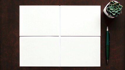 Blank paper divided into four sections with pen and succulent